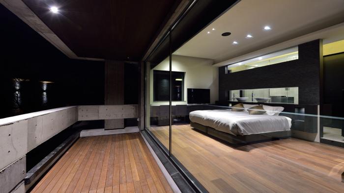 spacious balcony attached to bedroom with glass wall