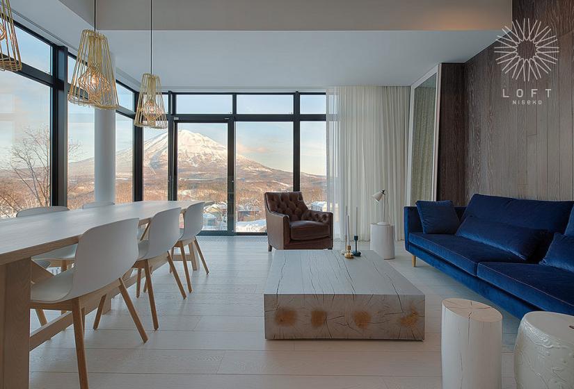 floor to ceiling windows offer Mt. Yotei view from the living room
