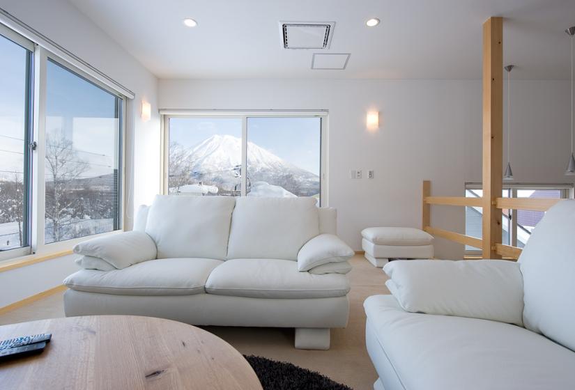 White lounge suite and view of Mt Yotei