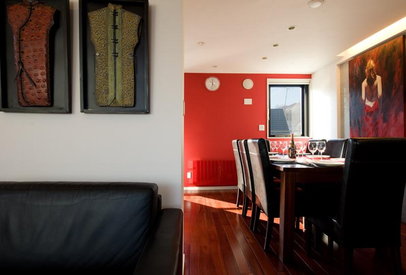 dining area with wall art and large wooden table
