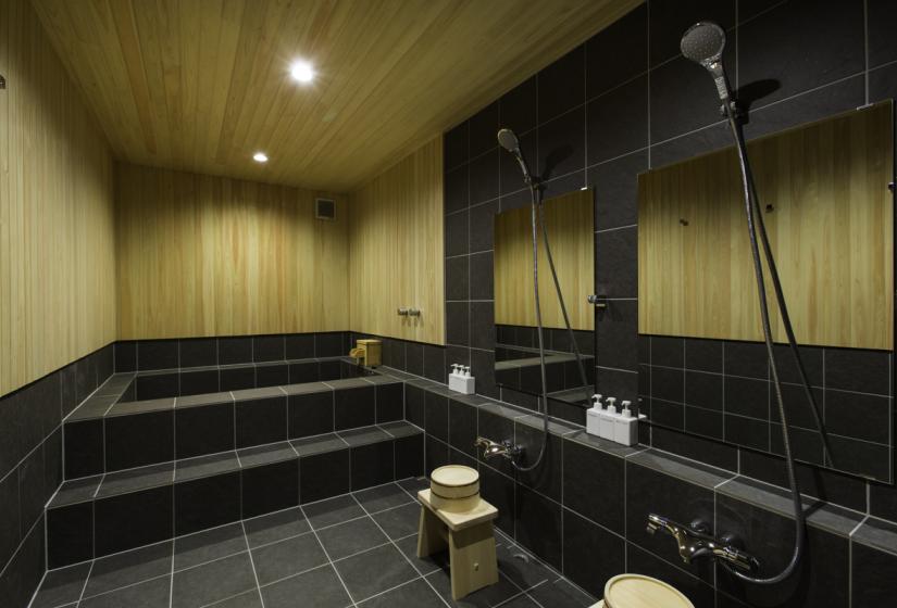 dark tile onsen bathroom