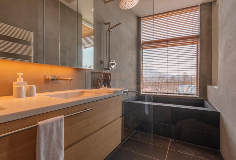 sink, bath, and shower with views out the window