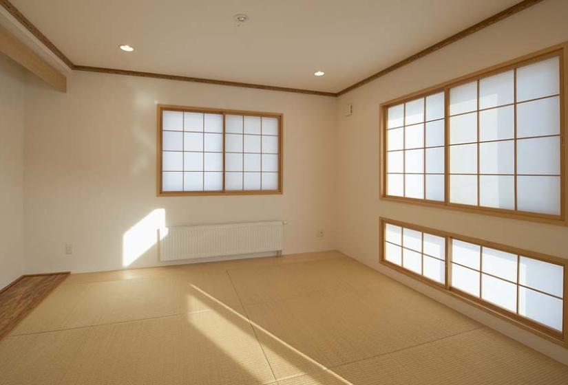 Japanese tatami room with Japanese style paper screens on the windows