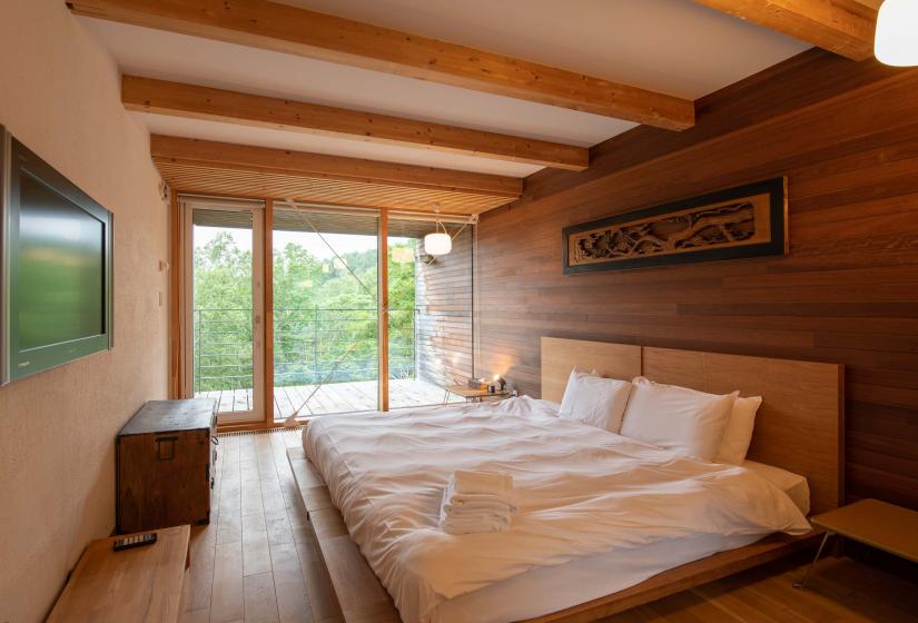 Bedroom with wooden feature wall
