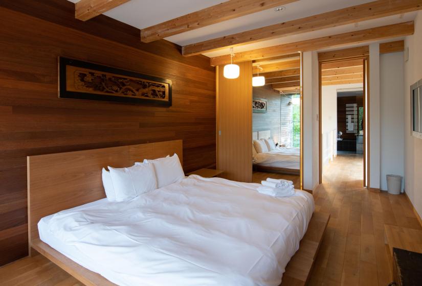 Bedroom with wooden feature wall
