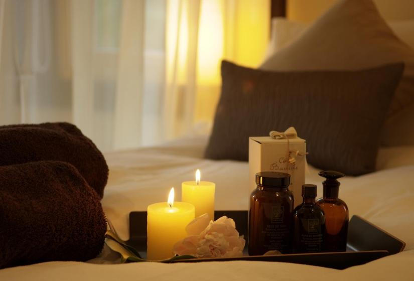 candles and toiletries made up on the double bed