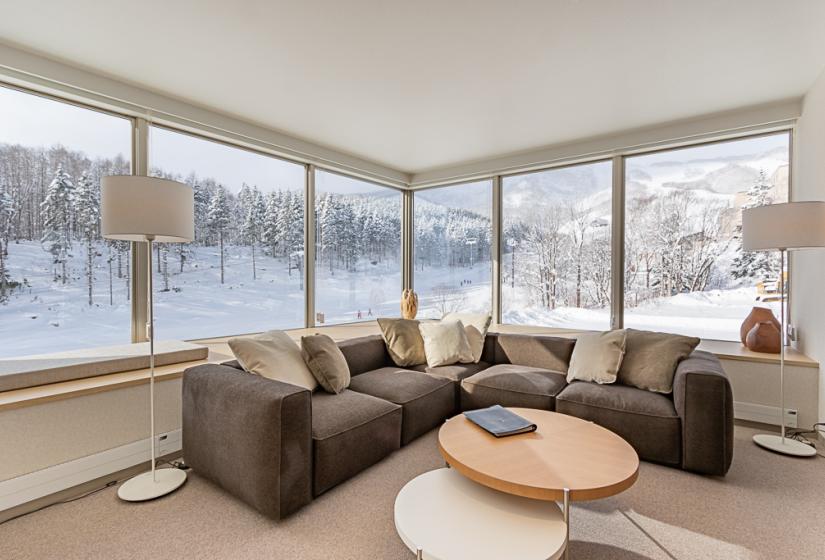 The Maples 2/3 bedroom apartment Round table and corner sofa with views to the ski resort
