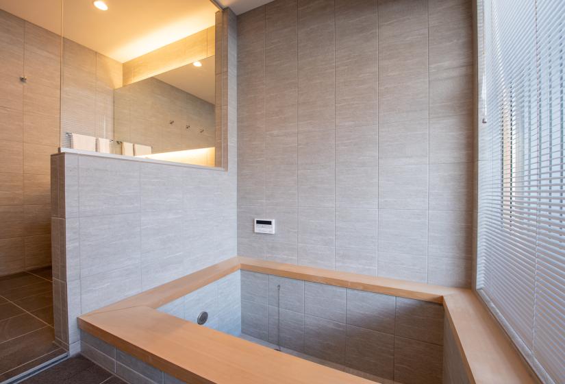 A square wooden edged bathtub.
