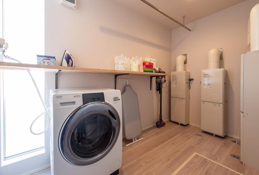 A laundry room with large washer