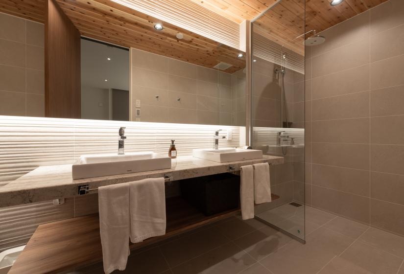 A bathroom with two hand basins     