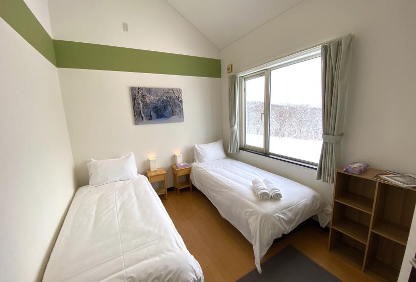 Two made up single beds