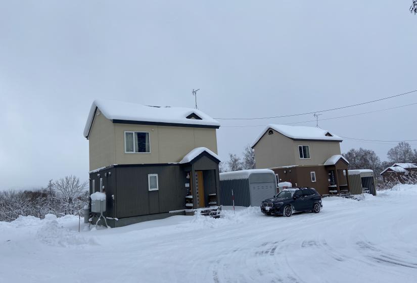 Two twin buildings with snowy roof