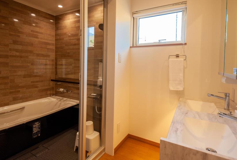 A bathroom bath and sink