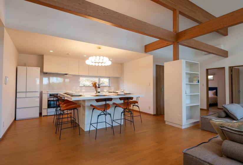 Dining table and kitchen behind