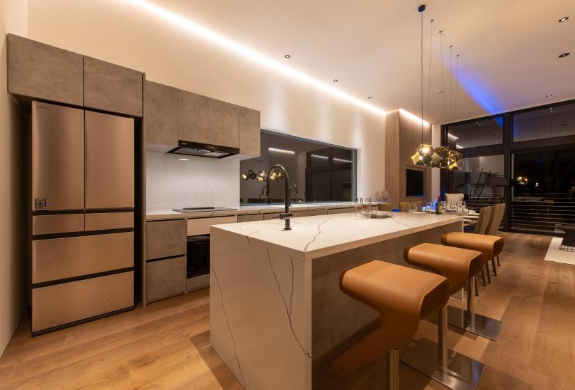 A breakfast bar with orange stools