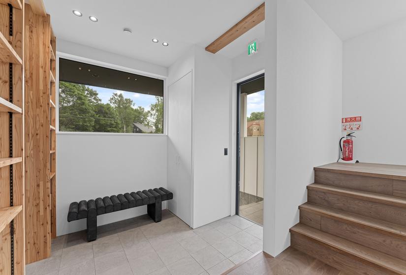 Stairs to the right and bench behind