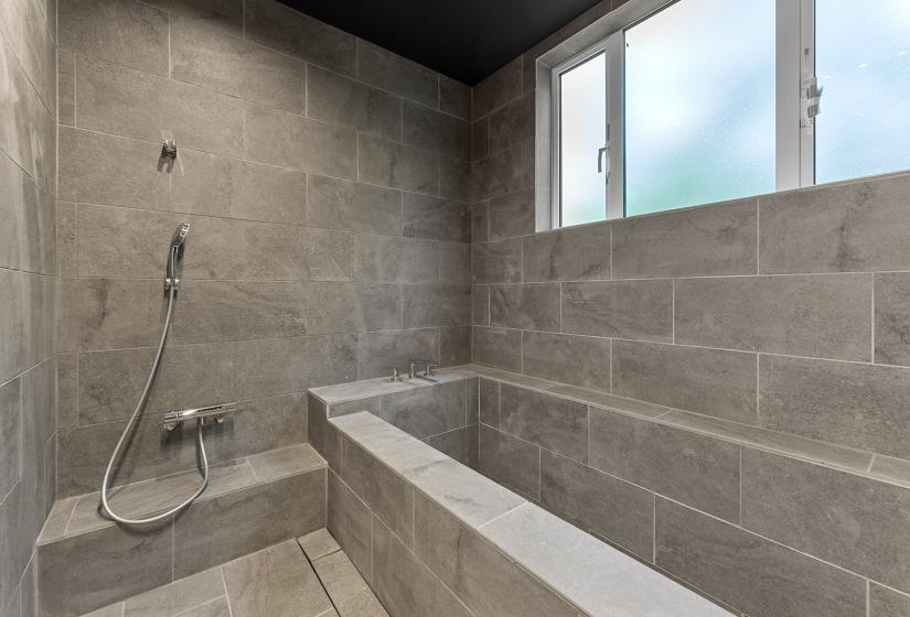 A grey slate tiled bathroom