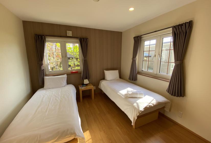 Two made up single beds